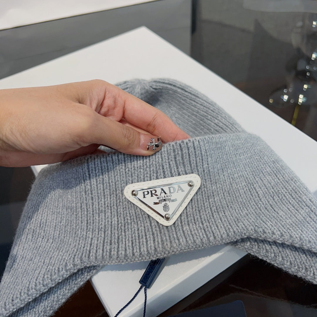New autumn and winter versatile fashion triangle logo ear protection women's style with plush warm knitted yarn hat