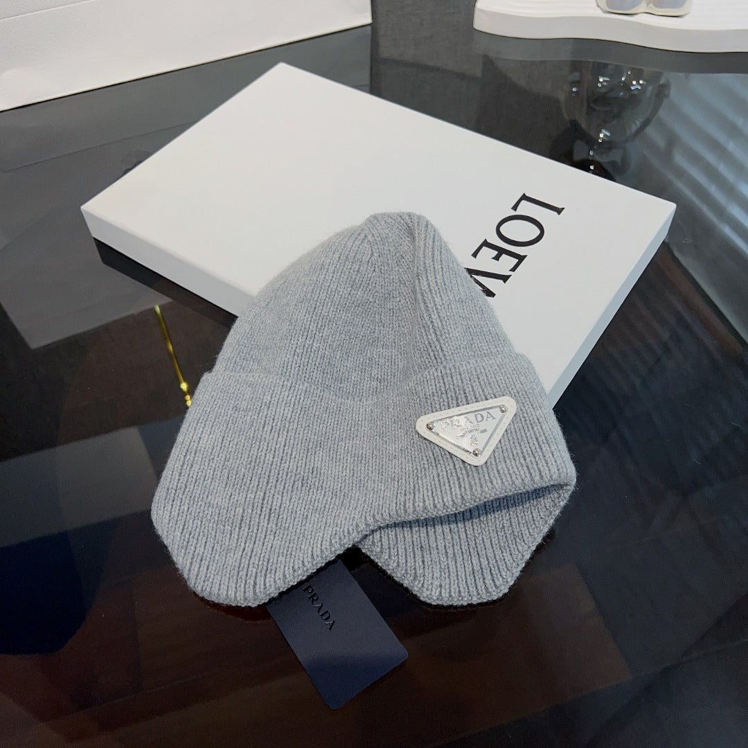 New autumn and winter versatile fashion triangle logo ear protection women's style with plush warm knitted yarn hat