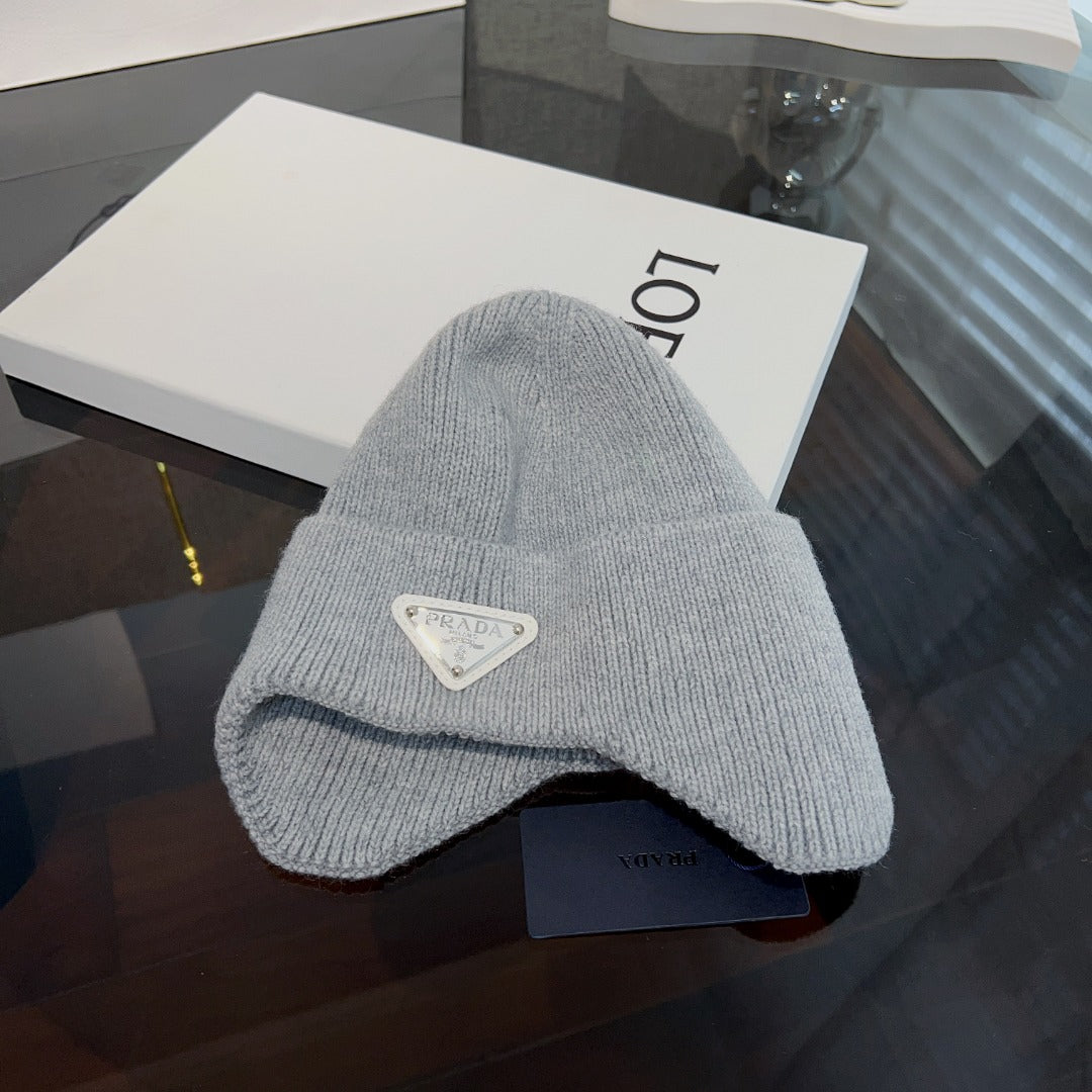 New autumn and winter versatile fashion triangle logo ear protection women's style with plush warm knitted yarn hat
