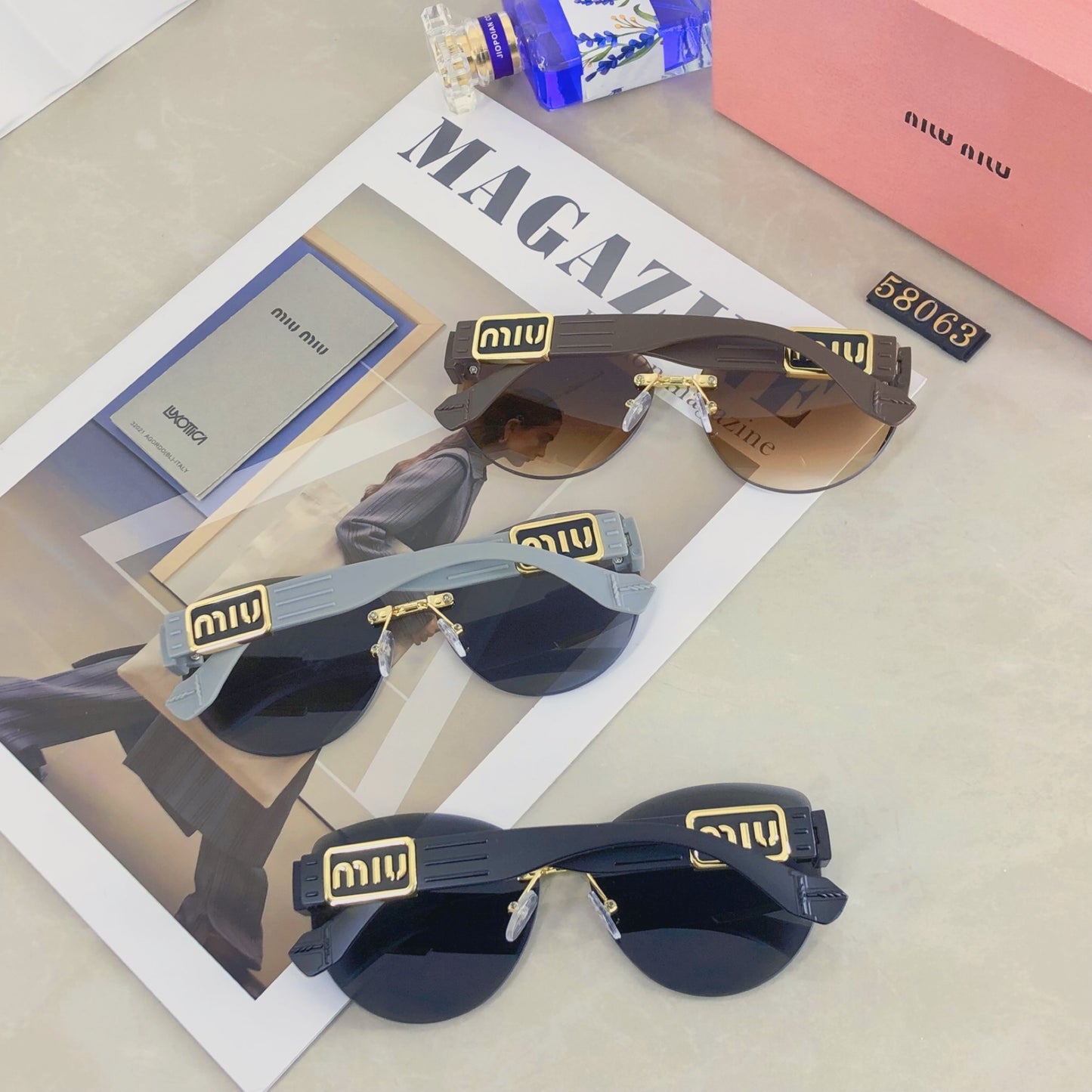 New fashion trend miu frameless cut edge sunglasses for women, high-end sunglasses for celebrities, same style large frame street photography UV resistant sunglasses