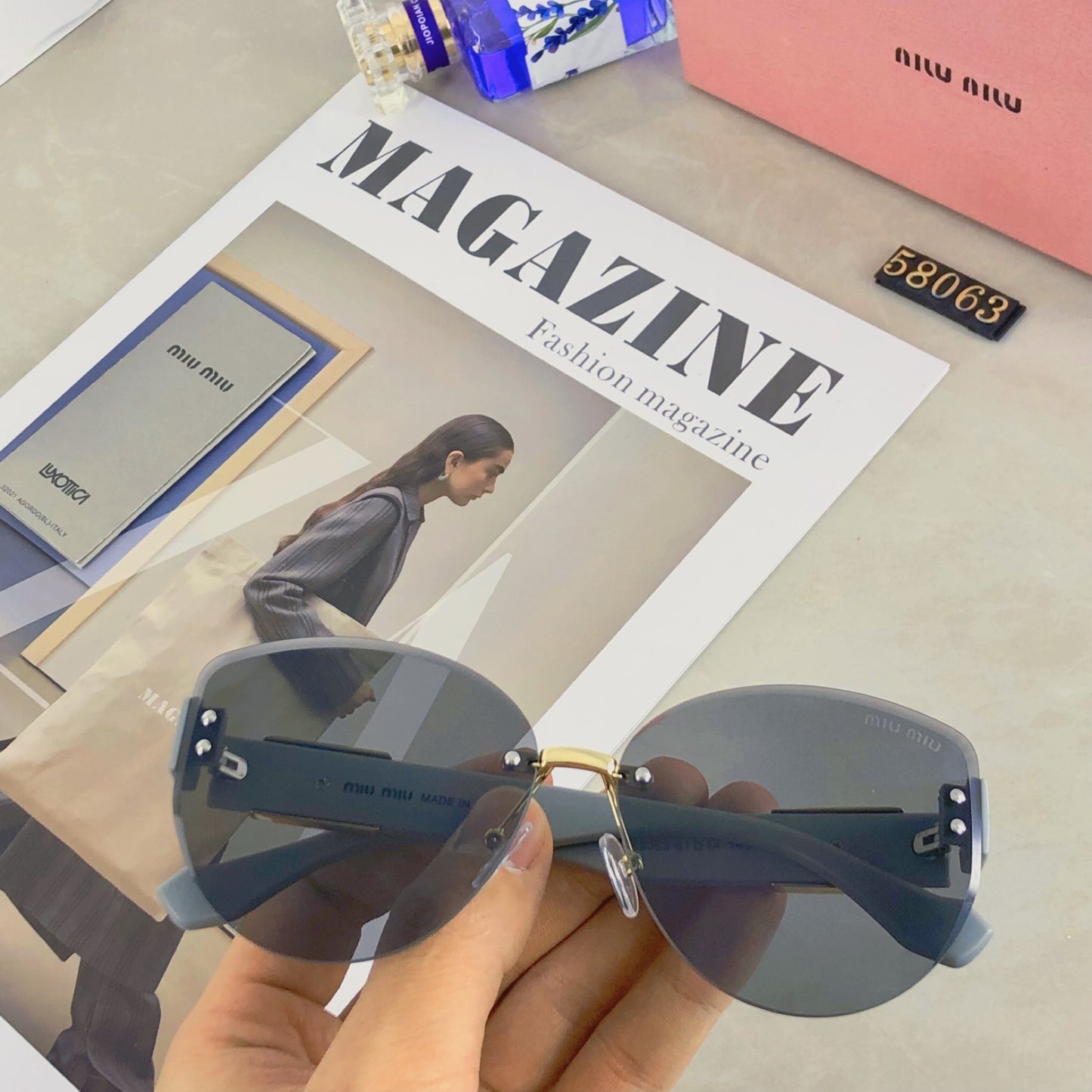 New fashion trend miu frameless cut edge sunglasses for women, high-end sunglasses for celebrities, same style large frame street photography UV resistant sunglasses
